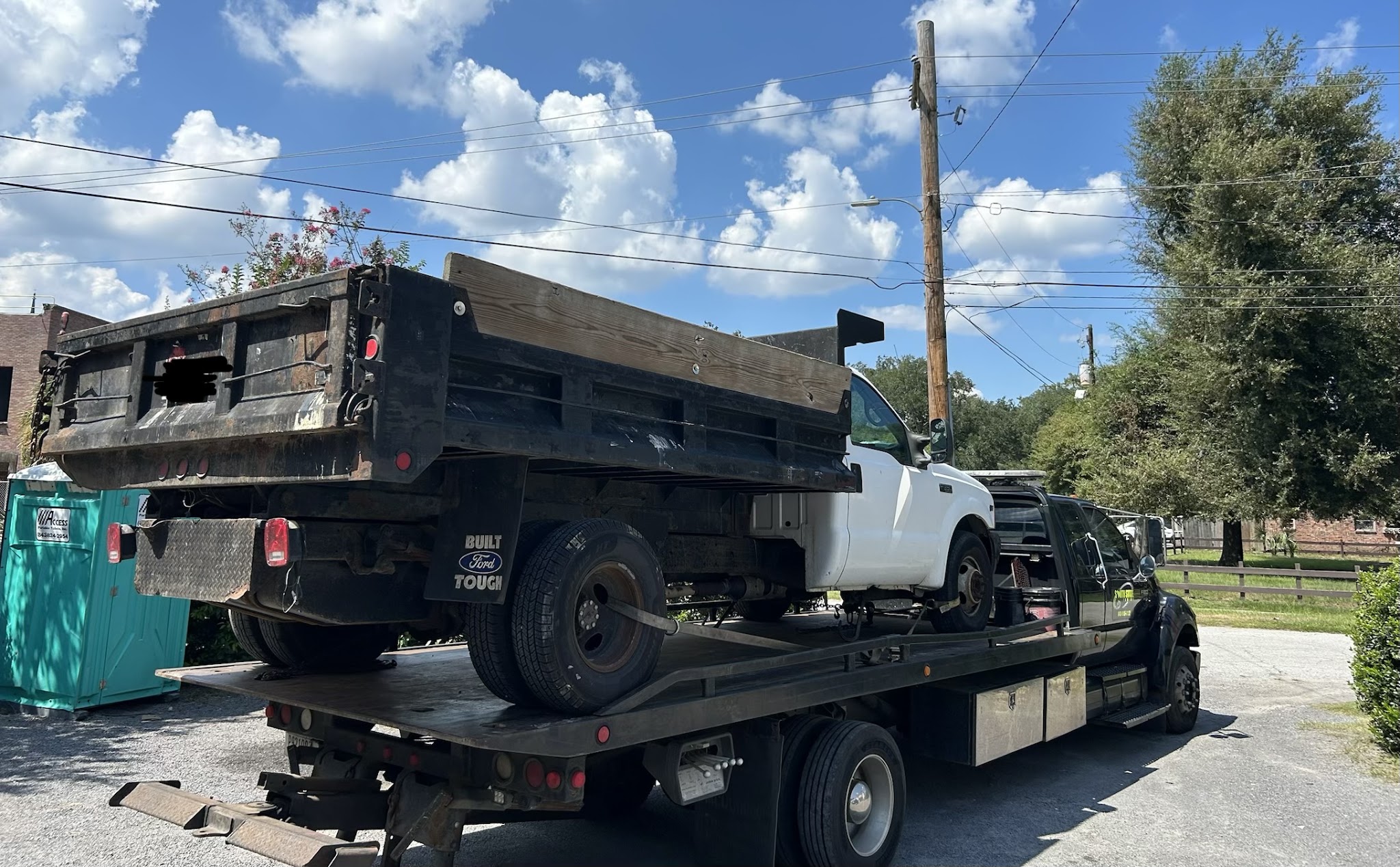 A dump truck loaded on our flatbed